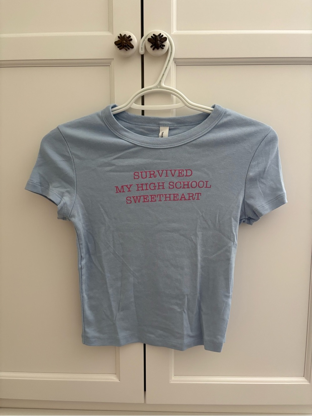 Light Blue Graphic Tee with Pink Text